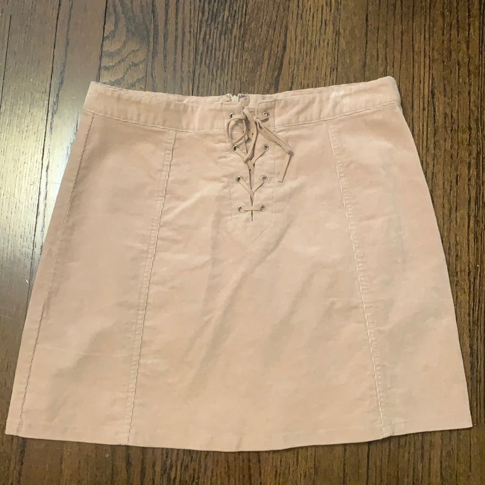 Light pink suede mini skirt with lace up detail